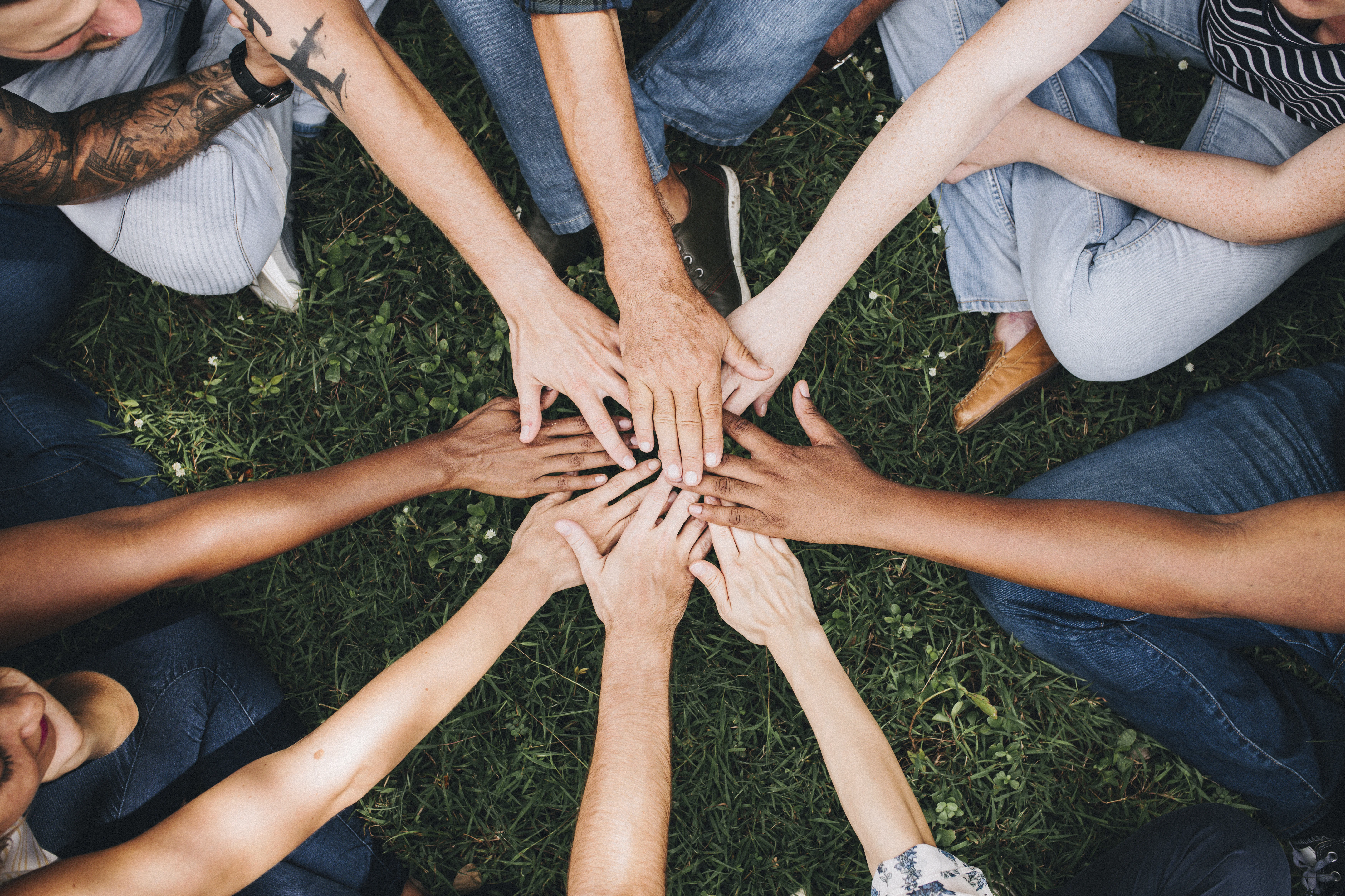 people with their hands in a circle